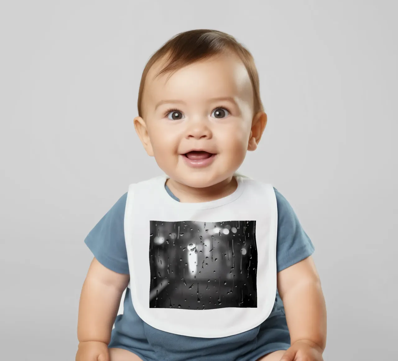 Raindrops on window creating a calming effect baby bib by DesignDoodle