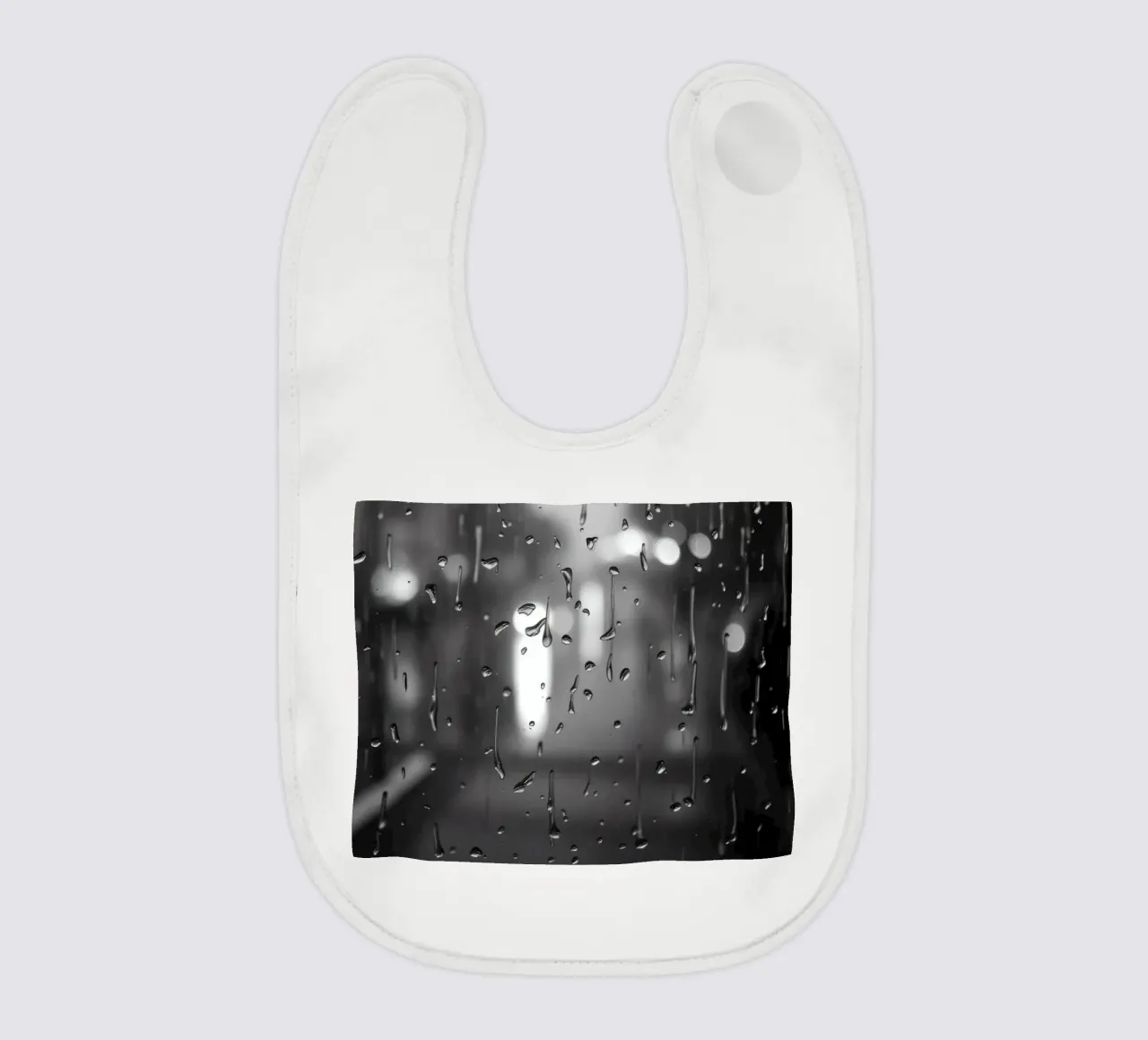 Raindrops on window creating a calming effect baby bib by DesignDoodle