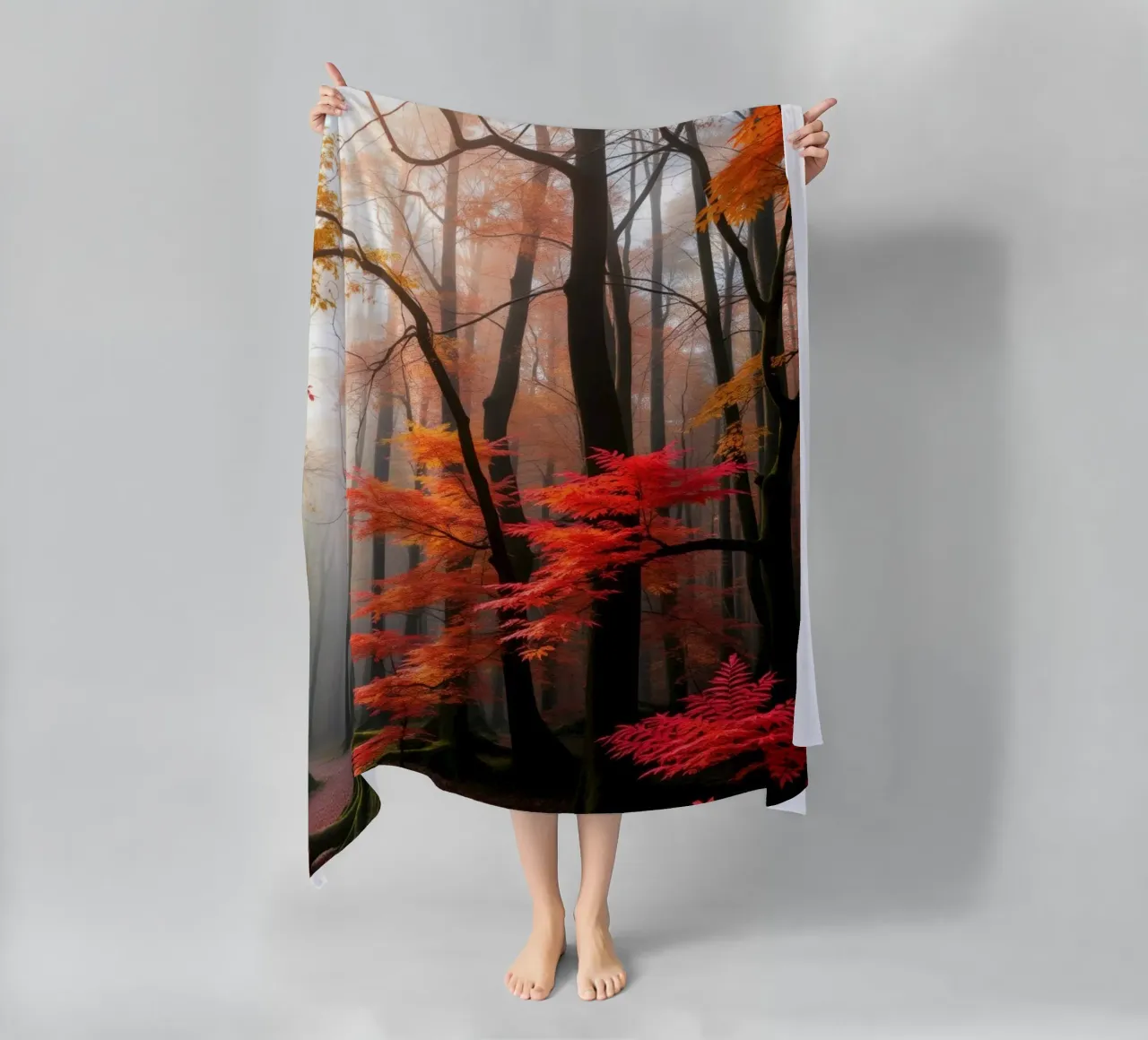 Captivating forest path adorned with vibrant autumn leaves beach towel by DesignDoodle