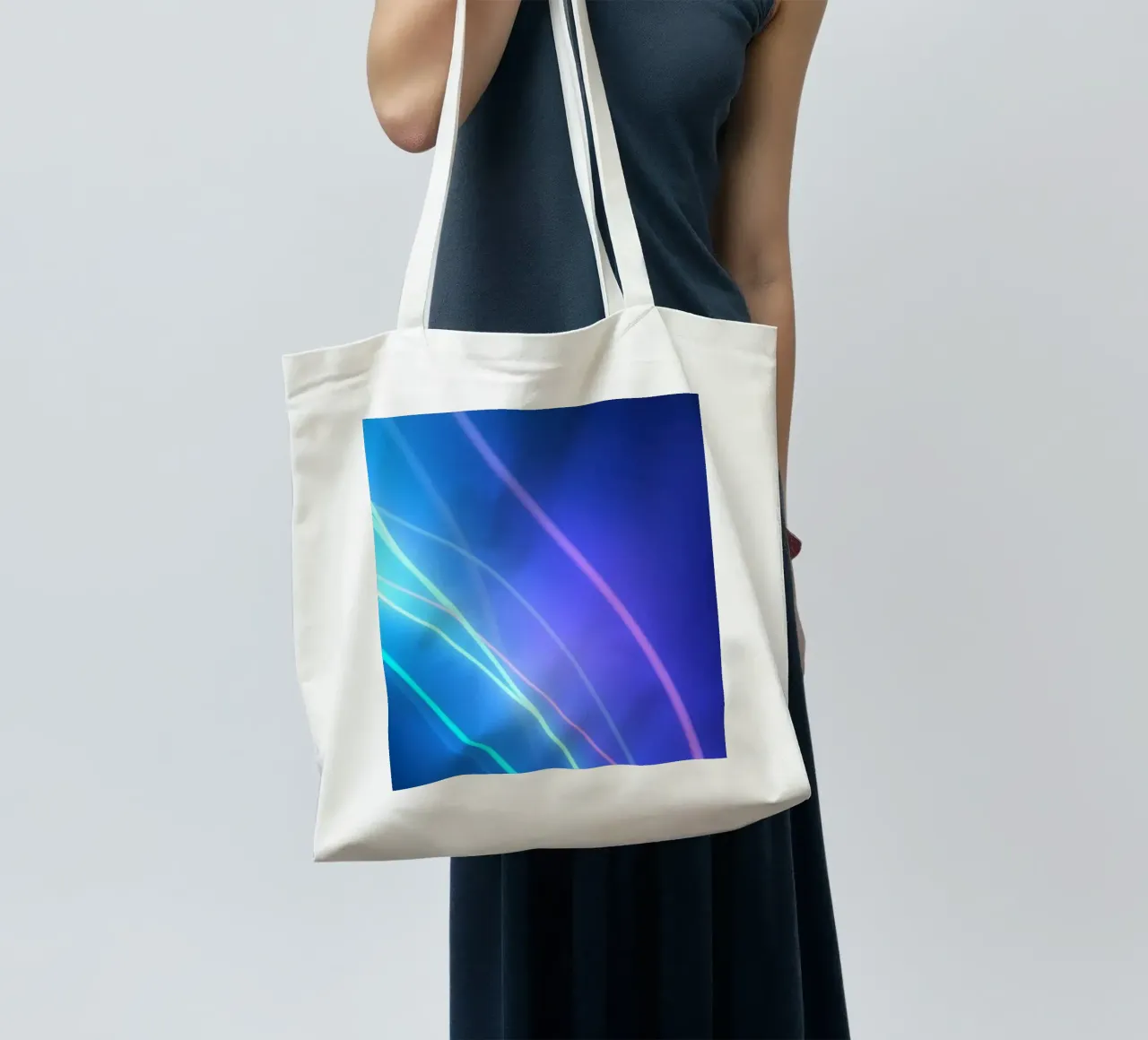 Vibrant abstract wallpaper design with flowing light trails tote bag by DesignDoodle