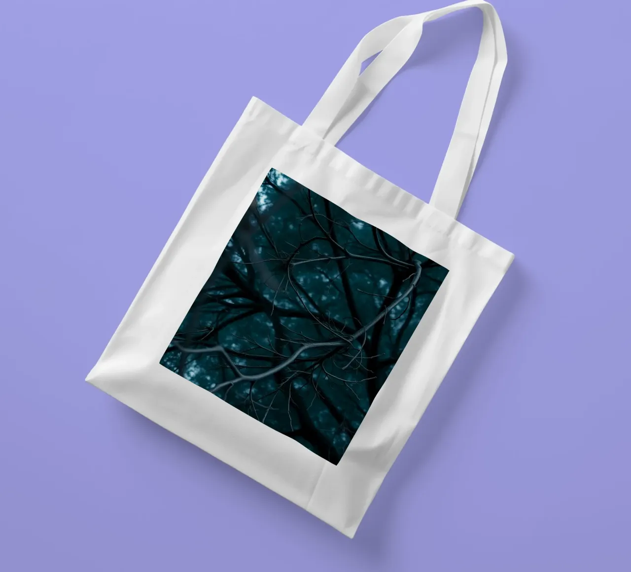 Branches intertwine against a dark, moody backdrop tote bag by DesignDoodle