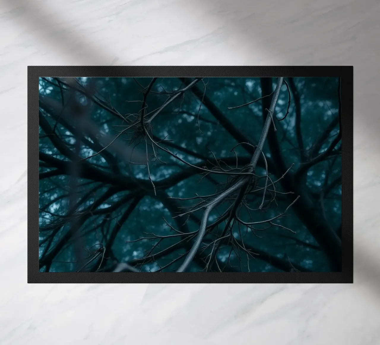 Branches intertwine against a dark, moody backdrop doormat by DesignDoodle