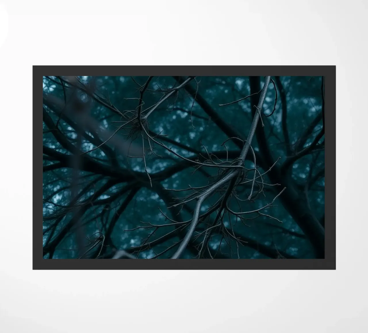 Branches intertwine against a dark, moody backdrop doormat by DesignDoodle