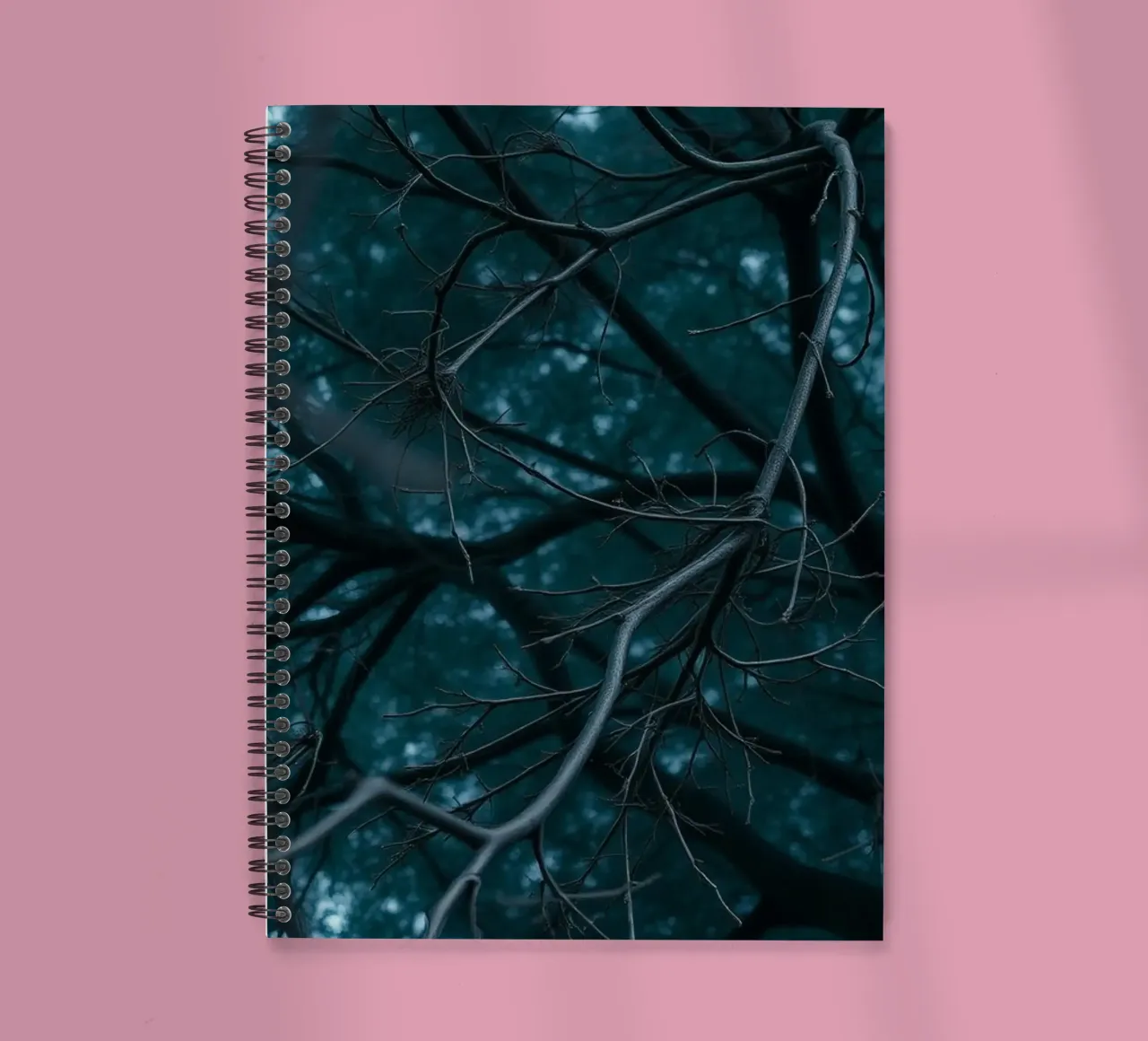 Branches intertwine against a dark, moody backdrop spiral notebook by DesignDoodle