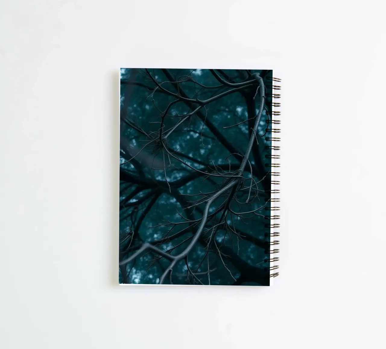 Branches intertwine against a dark, moody backdrop spiral notebook by DesignDoodle