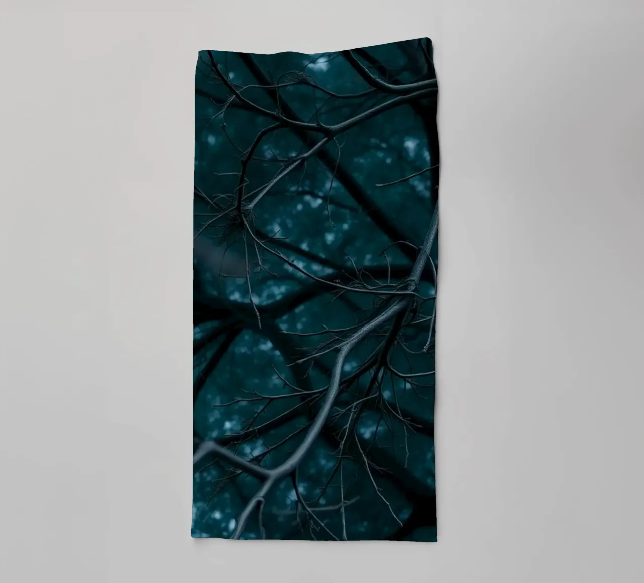 Branches intertwine against a dark, moody backdrop towel by DesignDoodle