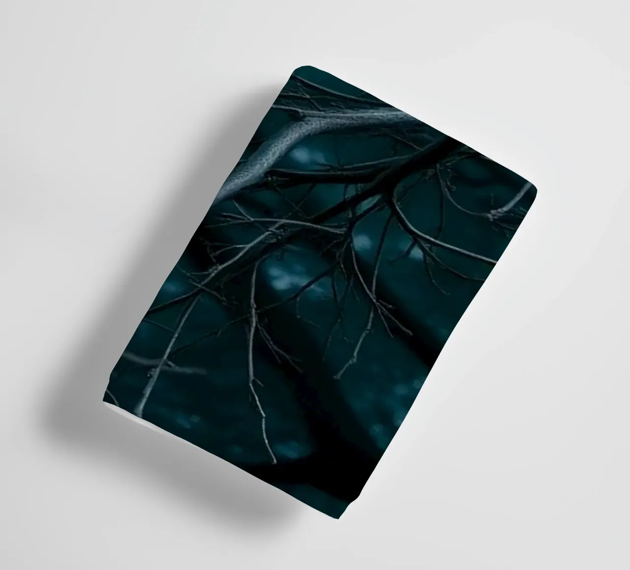 Branches intertwine against a dark, moody backdrop towel by DesignDoodle
