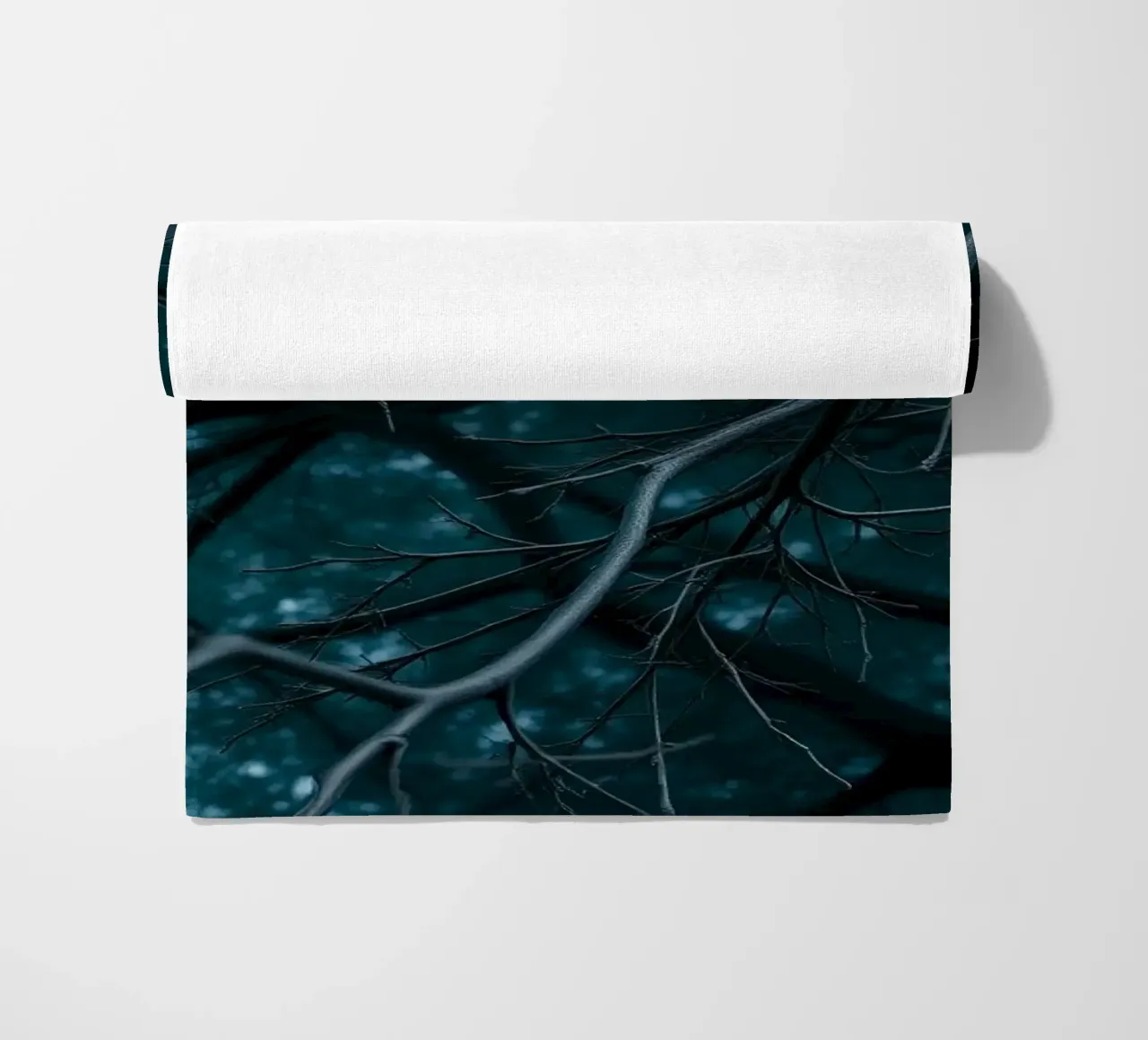 Branches intertwine against a dark, moody backdrop beach towel by DesignDoodle
