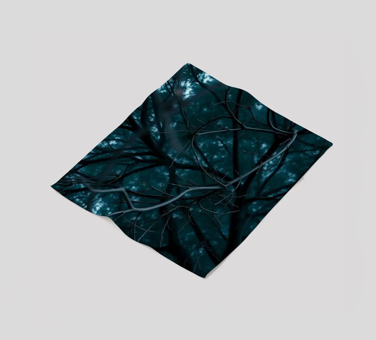 Branches intertwine against a dark, moody backdrop fleece blanket by DesignDoodle