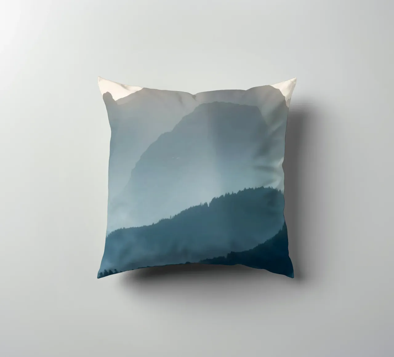 Beautiful mountain landscape with soft fog and gentle light decorative cushion by DesignDoodle