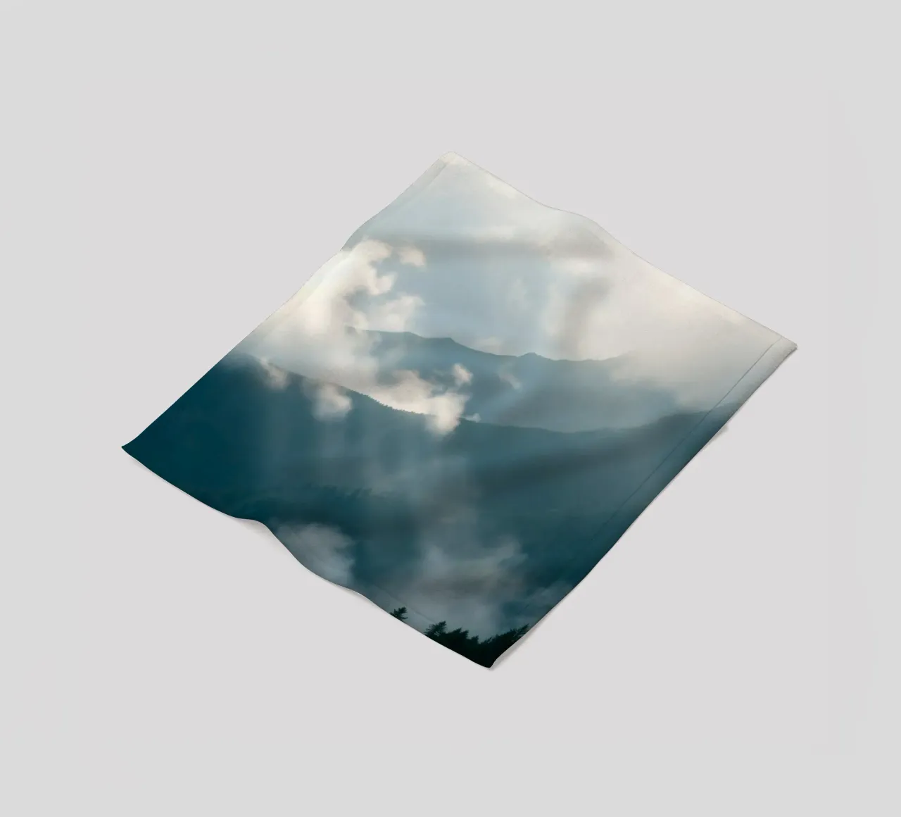 Mountain landscape with mist and clouds creating a serene fleece blanket by DesignDoodle
