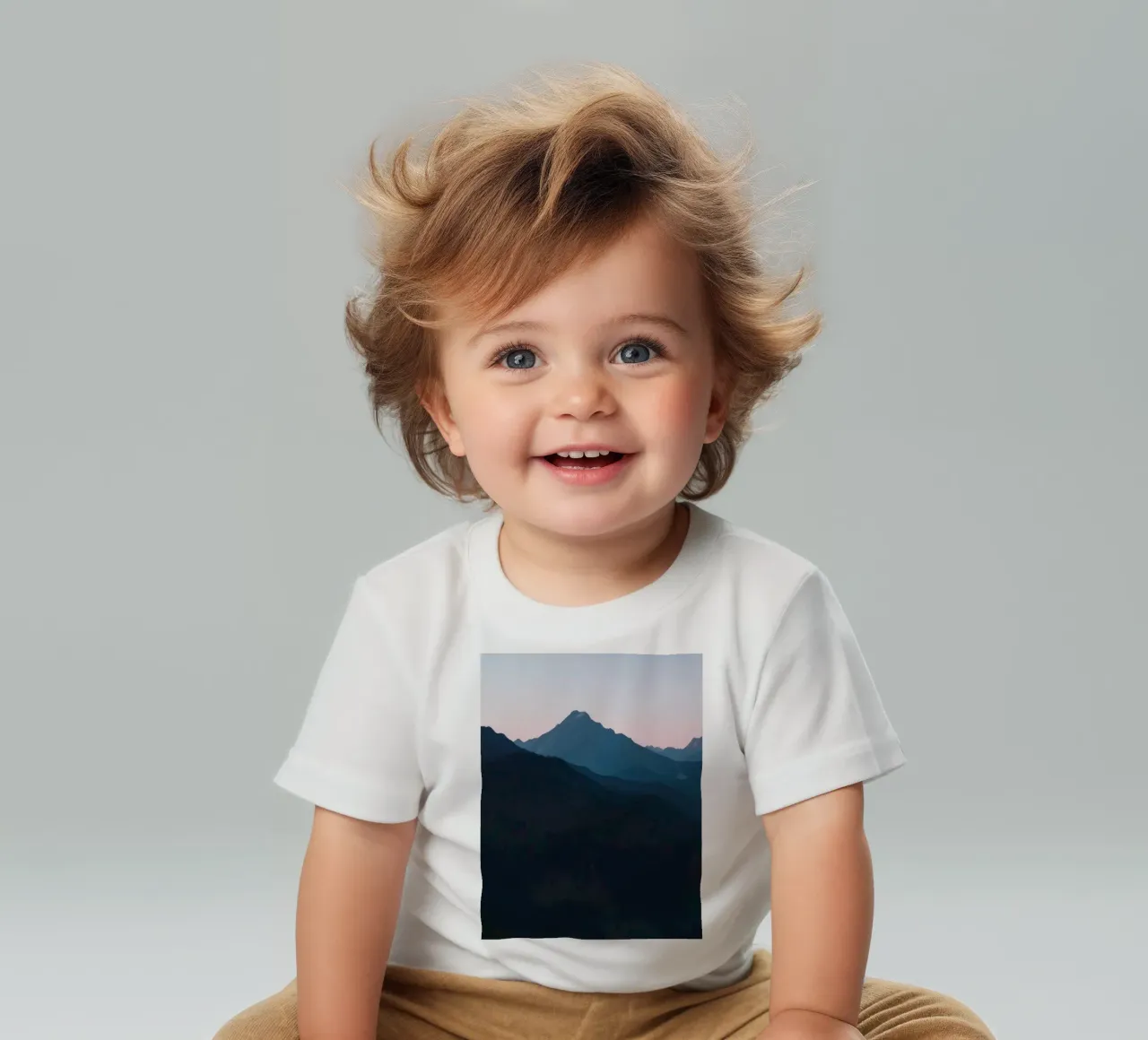 Serene mountain silhouettes at dusk create a tranquil feel baby t-shirt by DesignDoodle