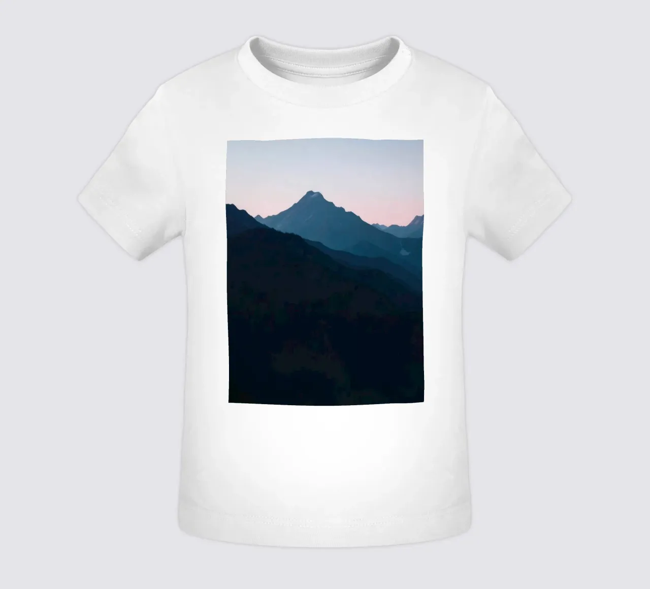 Serene mountain silhouettes at dusk create a tranquil feel baby t-shirt by DesignDoodle