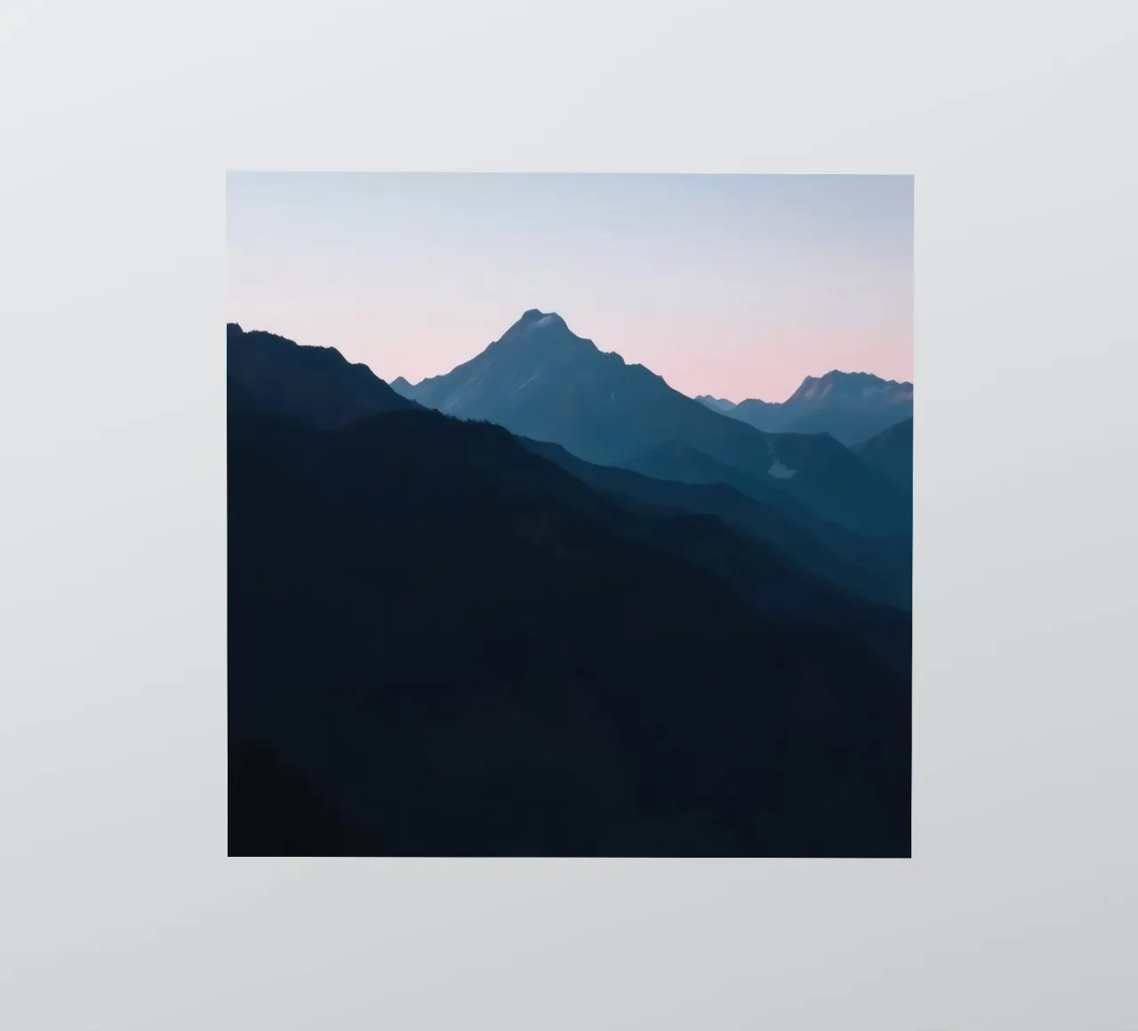 Serene mountain silhouettes at dusk create a tranquil feel sticker by DesignDoodle