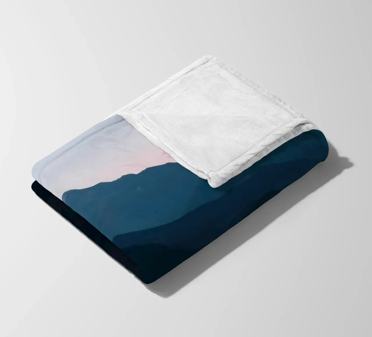 Serene mountain silhouettes at dusk create a tranquil feel fleece blanket by DesignDoodle