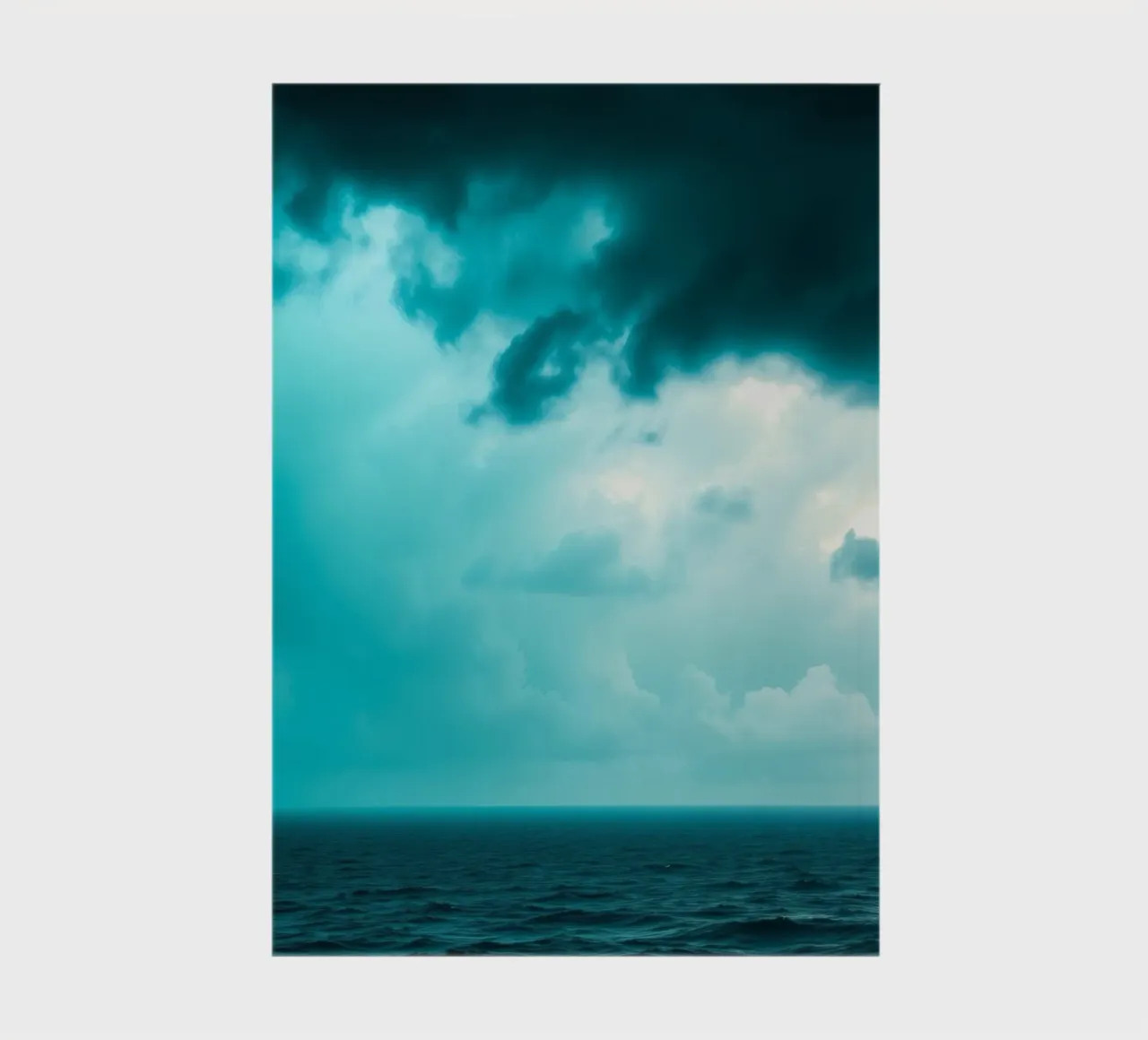 Dynamic sky over calm ocean creates serene backdrop for mobi notebook by DesignDoodle