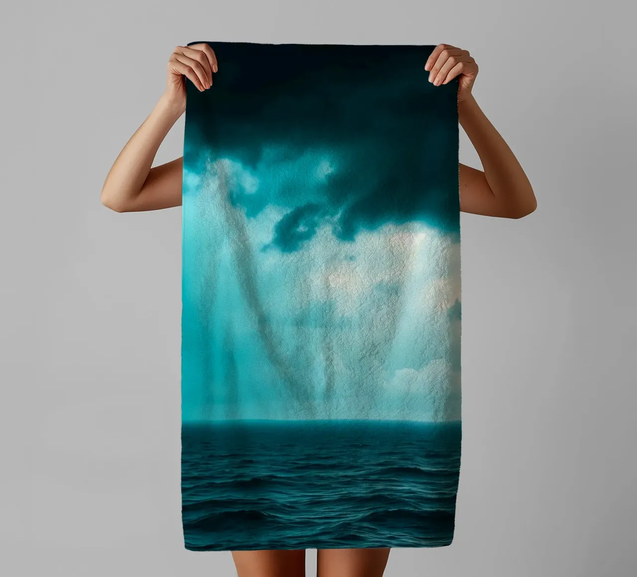 Dynamic sky over calm ocean creates serene backdrop for mobi towel by DesignDoodle