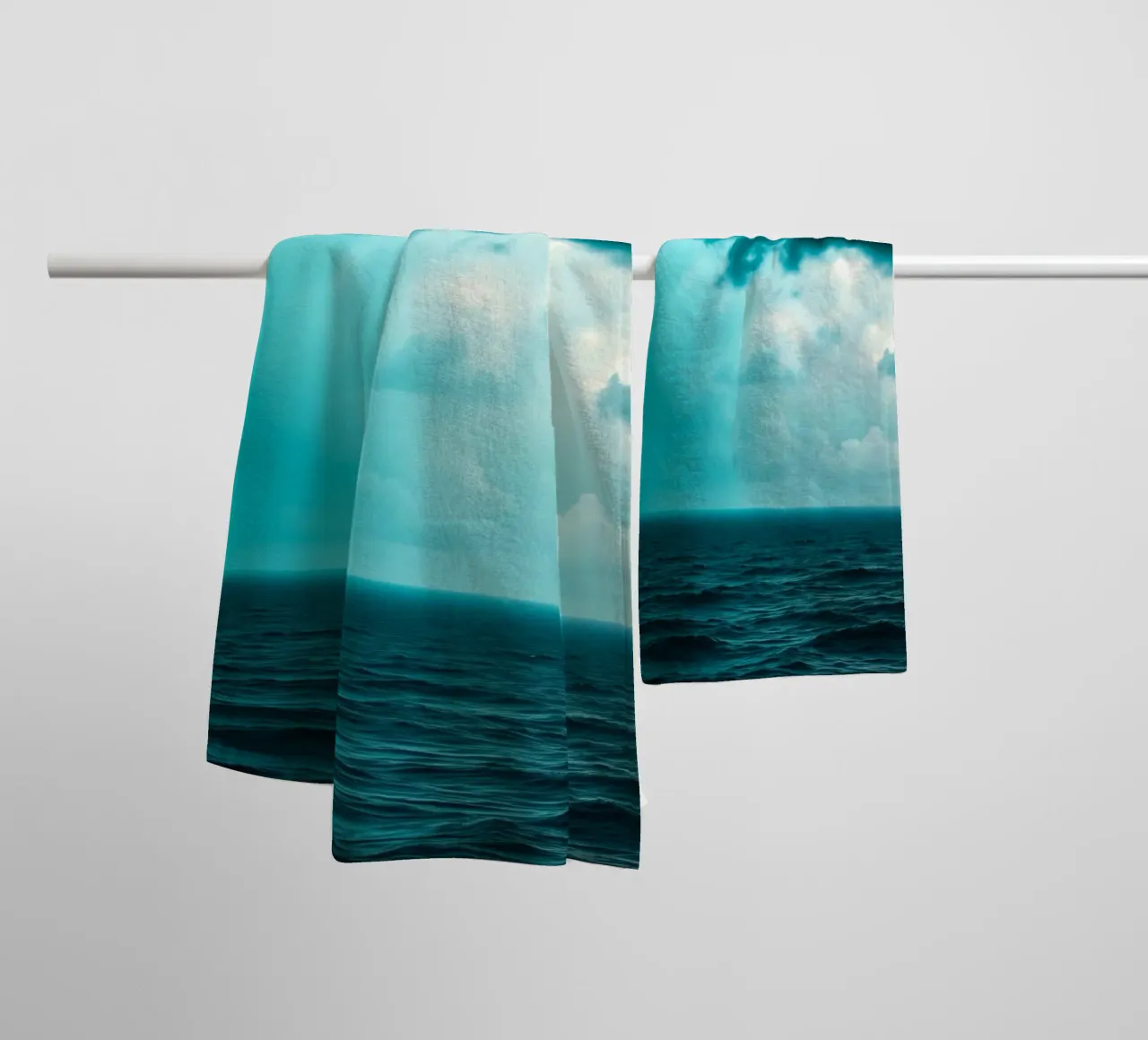 Dynamic sky over calm ocean creates serene backdrop for mobi towel by DesignDoodle