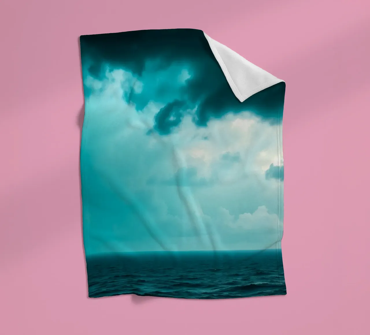 Dynamic sky over calm ocean creates serene backdrop for mobi fleece blanket by DesignDoodle