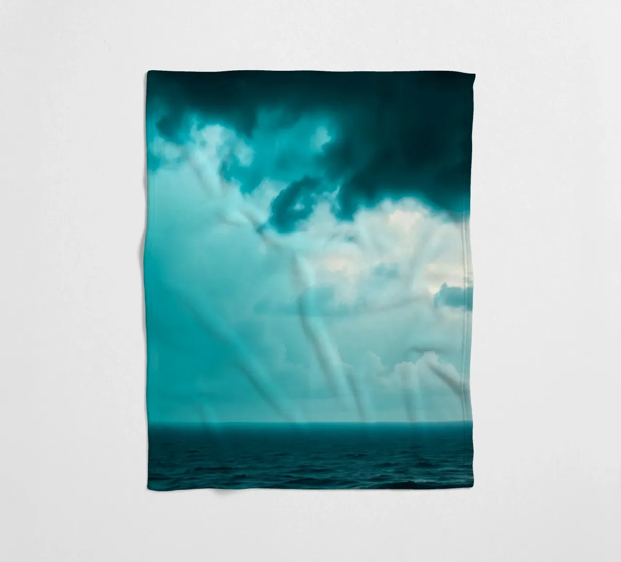Dynamic sky over calm ocean creates serene backdrop for mobi fleece blanket by DesignDoodle