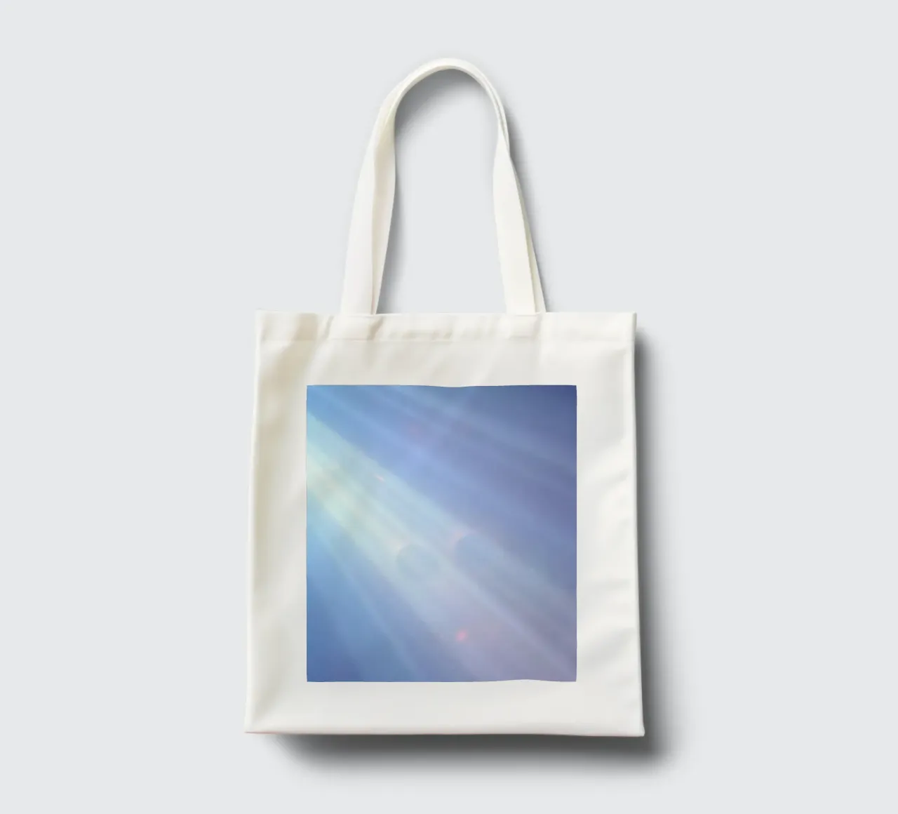 Soft blue light beams create a calming abstract background tote bag by DesignDoodle