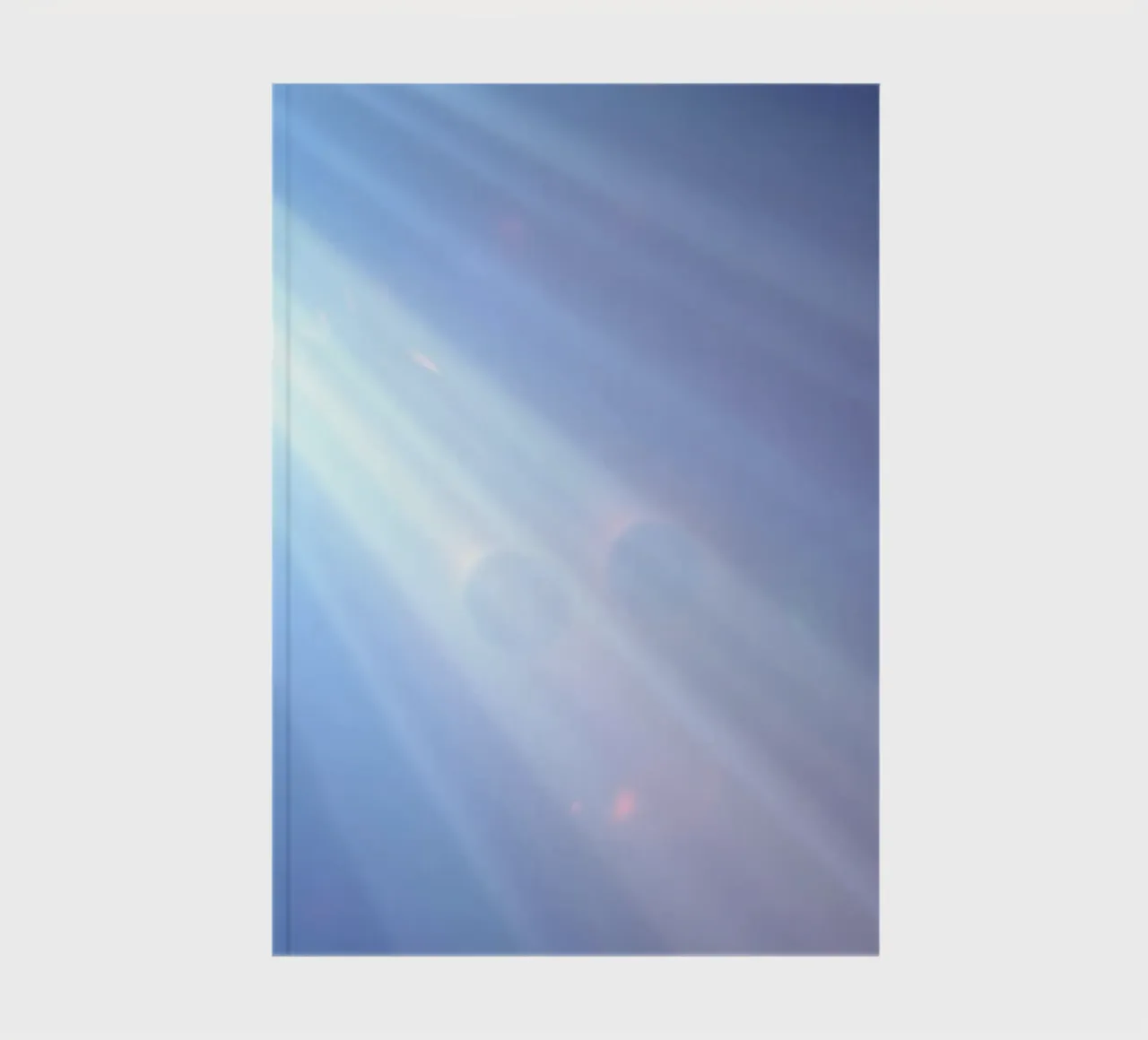 Soft blue light beams create a calming abstract background notebook by DesignDoodle