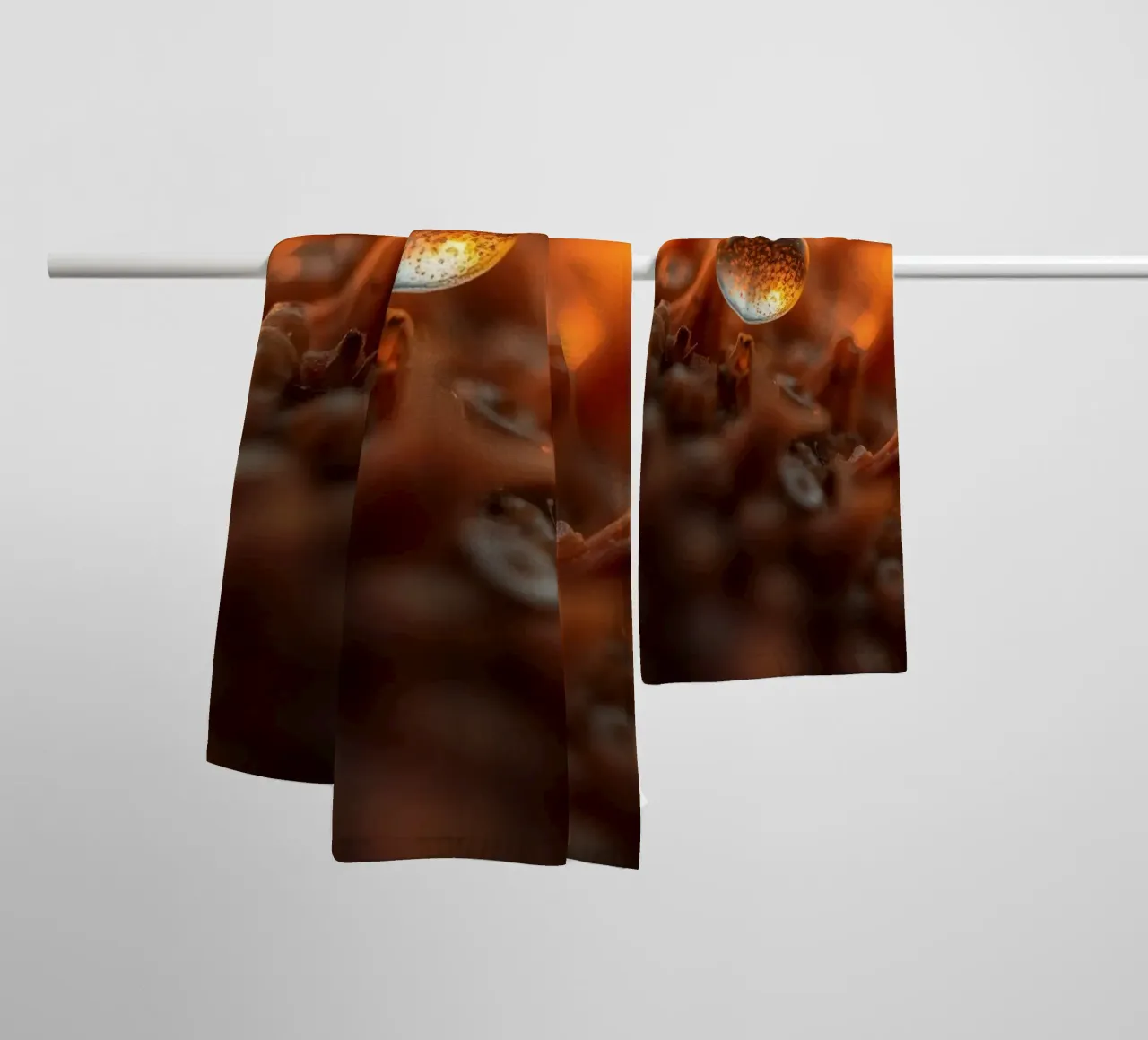Captured dew drop reflecting warm tones on plant surface towel by DesignDoodle