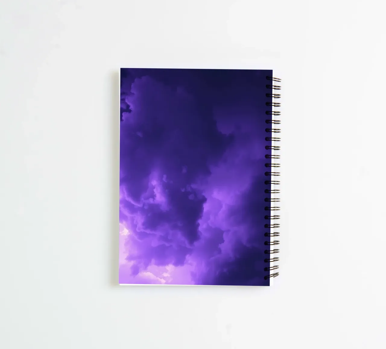 purple clouds filling the sky create a captivating art spiral notebook by DesignDoodle
