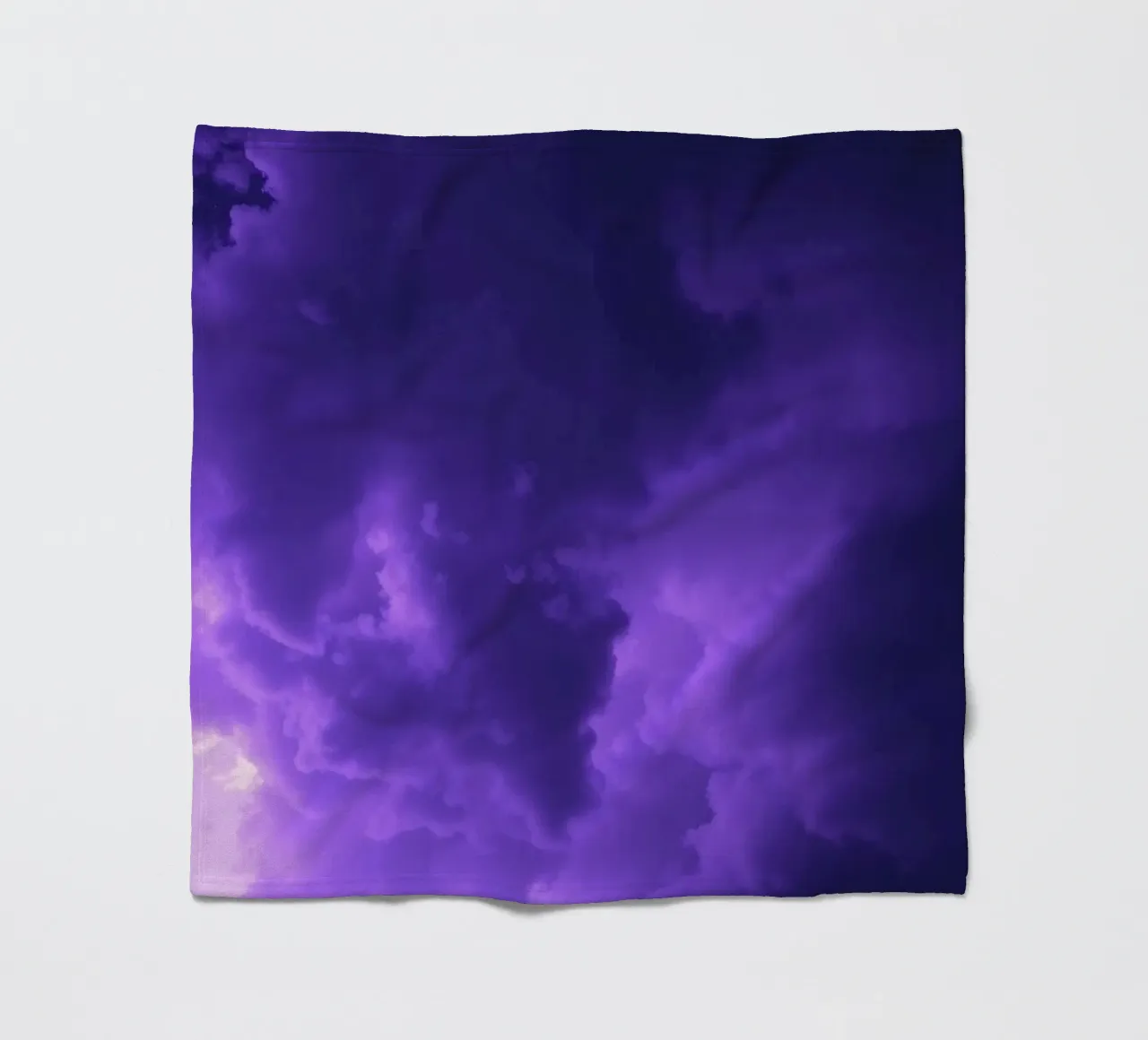 purple clouds filling the sky create a captivating art fleece blanket by DesignDoodle