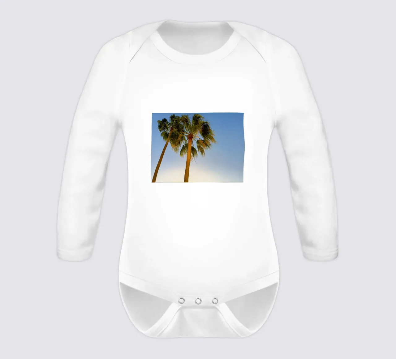 Palms long-sleeve baby romper by Massimo Frascogna