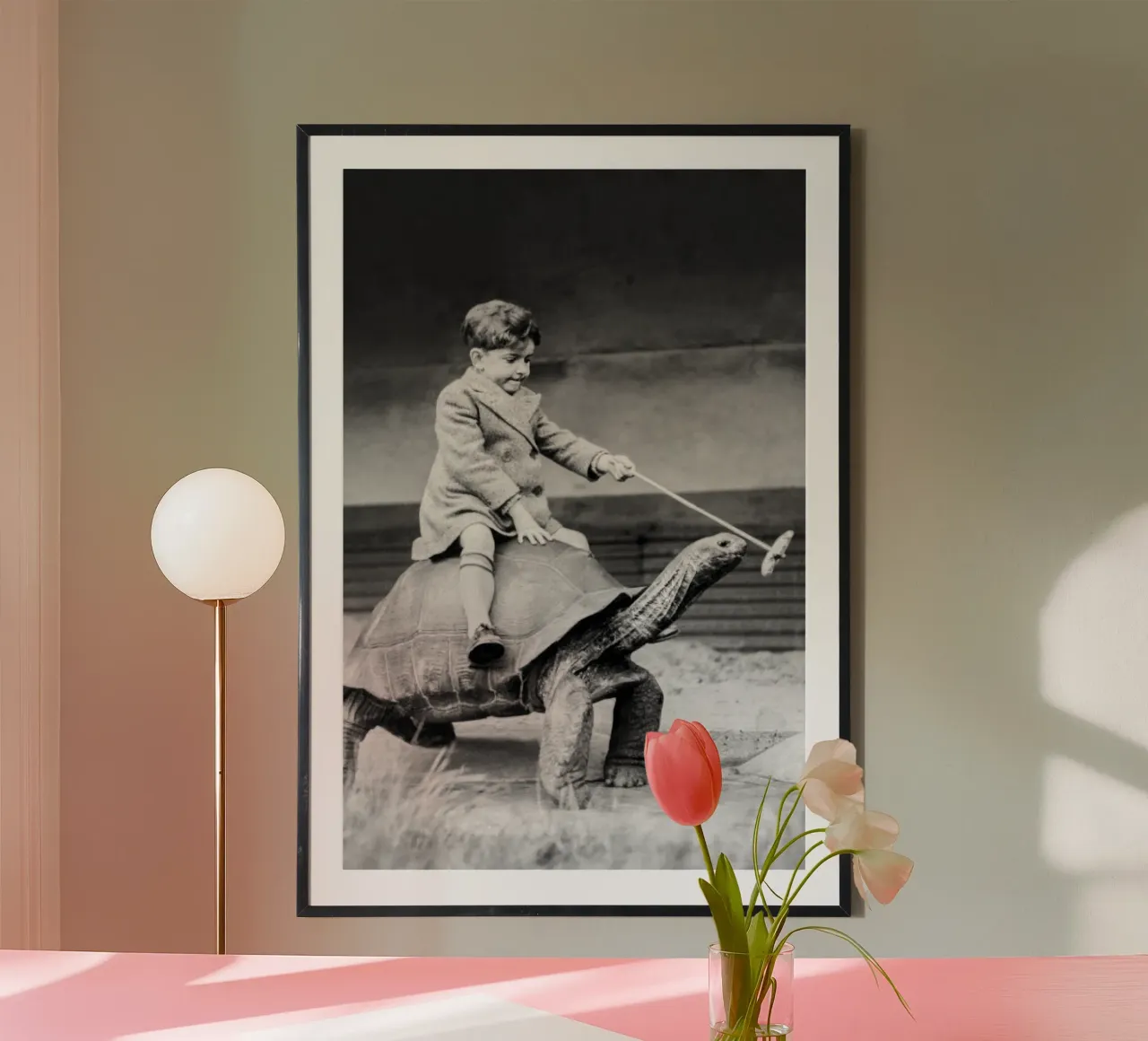 Ragazzo che cavalca una tartaruga gigante, arte vintage in bianco e nero poster con telaio in legno da Vibrant Vintage Prints