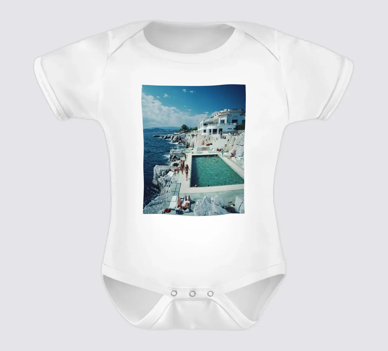 Sunbathing at the Beachside Pool Antibes, 1976 - Slim Aarons short-sleeve baby romper by The Poster UK
