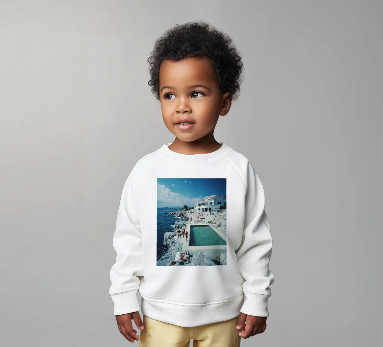 Sunbathing at the Beachside Pool Antibes, 1976 - Slim Aarons baby sweatshirt by The Poster UK