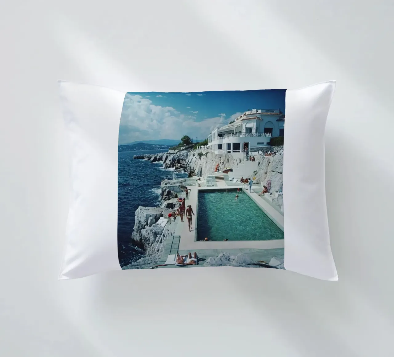 Sunbathing at the Beachside Pool Antibes, 1976 - Slim Aarons decorative cushion by The Poster UK
