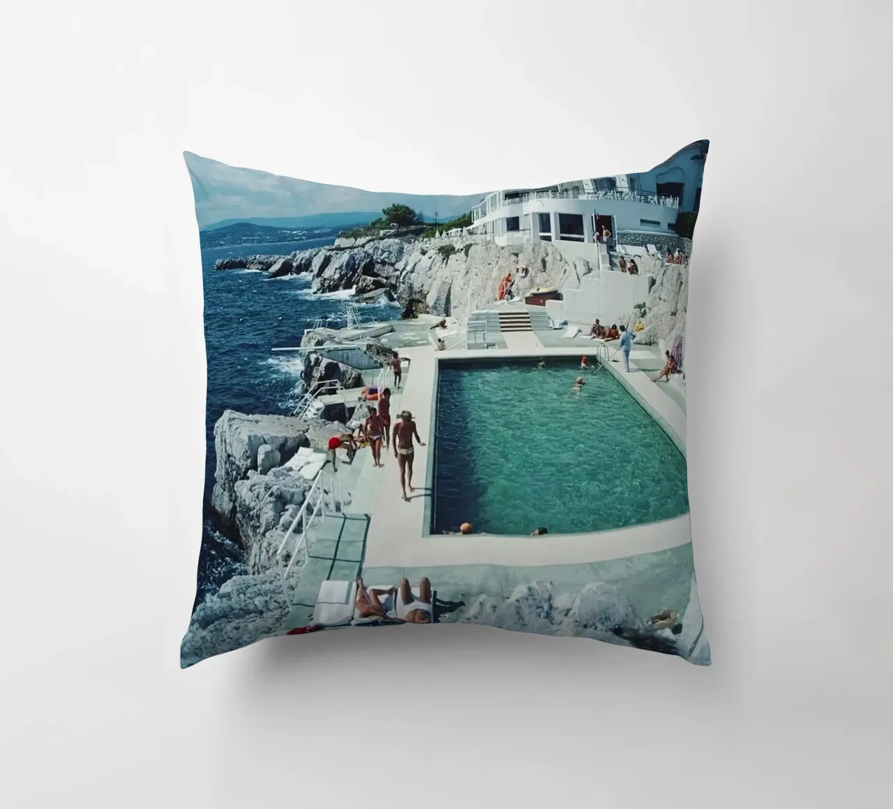 Sunbathing at the Beachside Pool Antibes, 1976 - Slim Aarons decorative cushion by The Poster UK