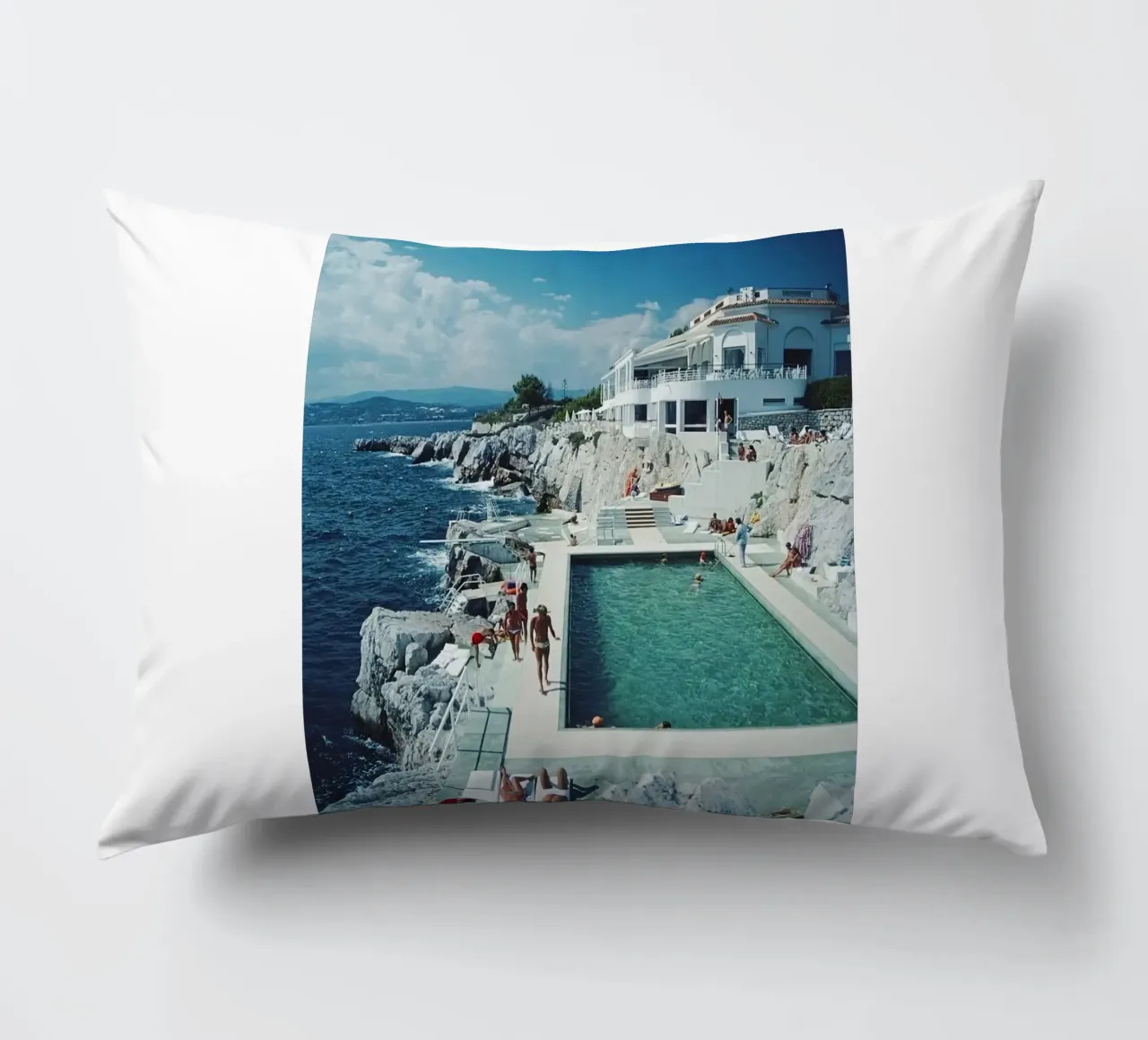 Sunbathing at the Beachside Pool Antibes, 1976 - Slim Aarons decorative cushion by The Poster UK