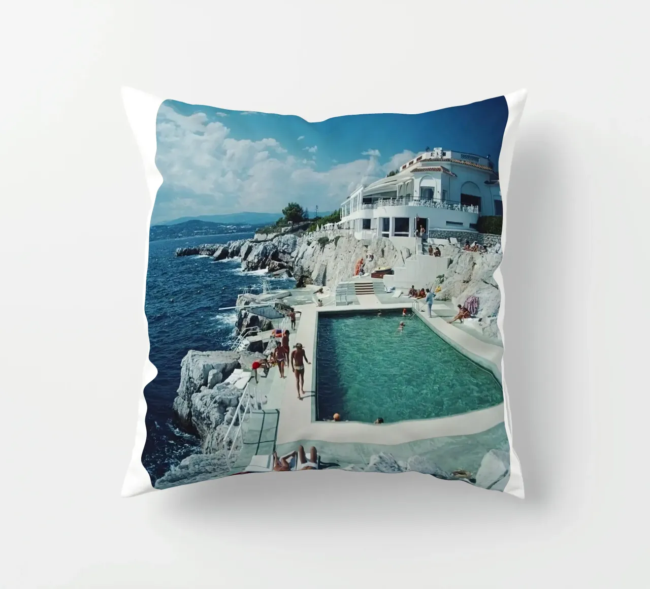 Sunbathing at the Beachside Pool Antibes, 1976 - Slim Aarons decorative cushion by The Poster UK