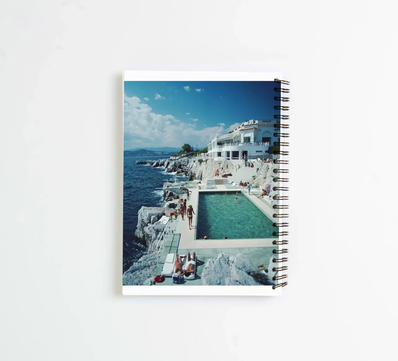 Sunbathing at the Beachside Pool Antibes, 1976 - Slim Aarons spiral notebook by The Poster UK
