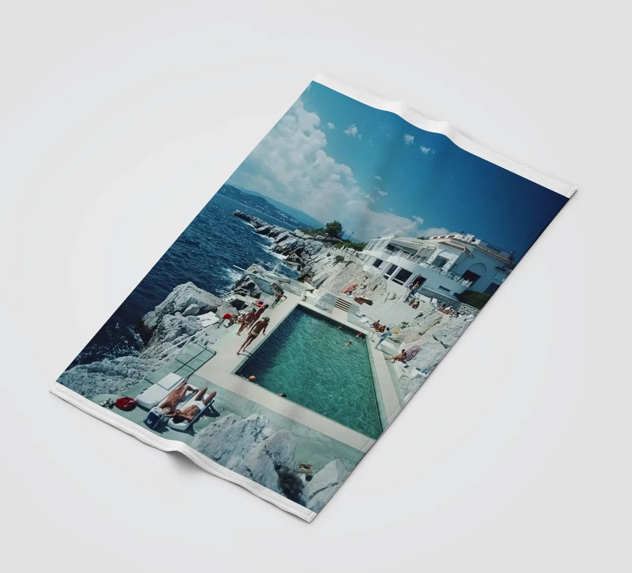 Sunbathing at the Beachside Pool Antibes, 1976 - Slim Aarons fleece blanket by The Poster UK