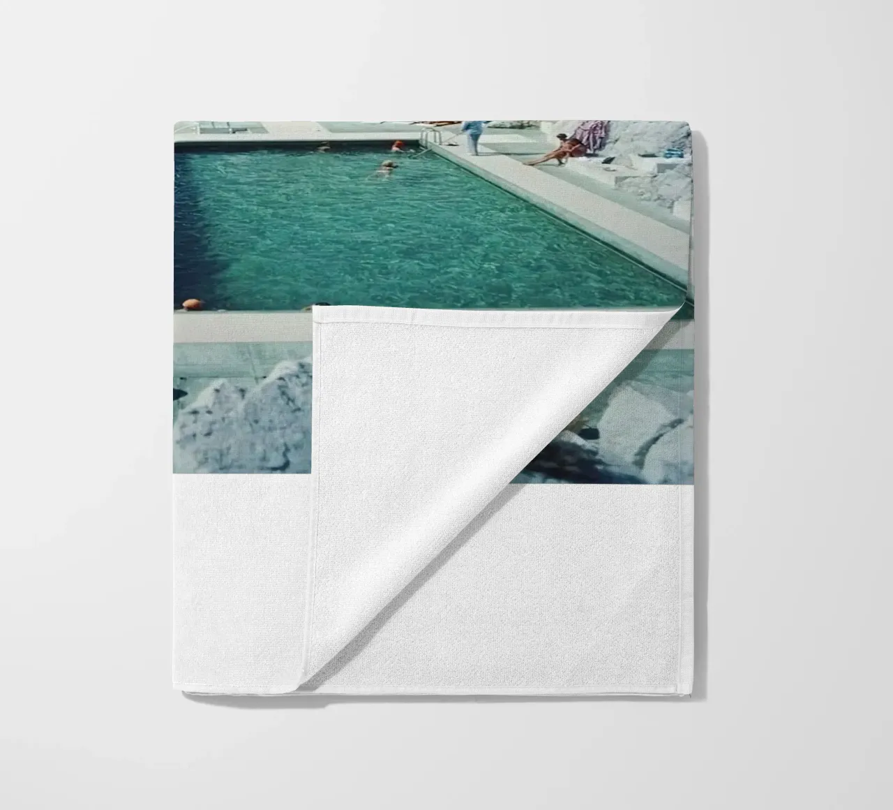 Sunbathing at the Beachside Pool Antibes, 1976 - Slim Aarons beach towel by The Poster UK