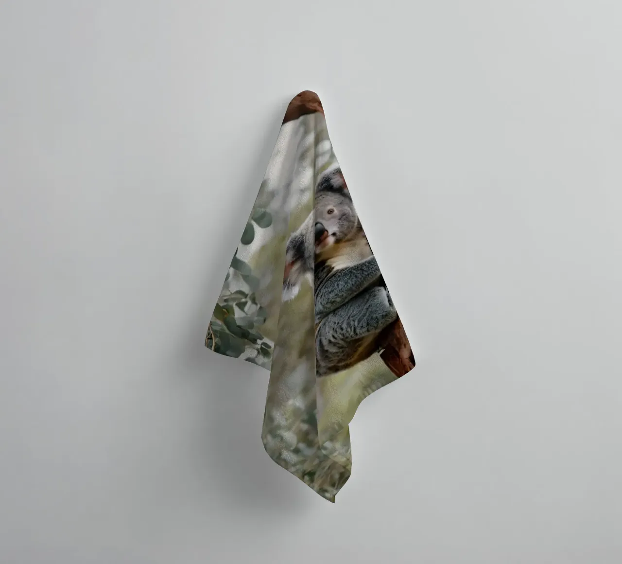 Koala climbing eucalyptus tree in its natural habitat during towel by DesignDoodle