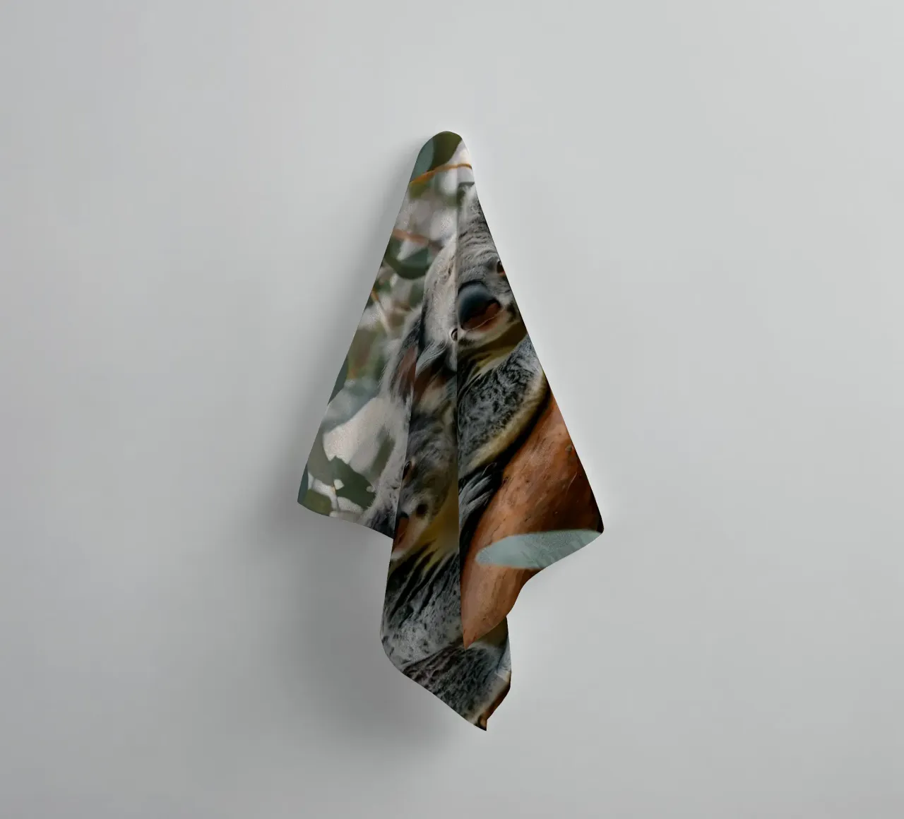 Two koalas resting together on a eucalyptus tree towel by DesignDoodle