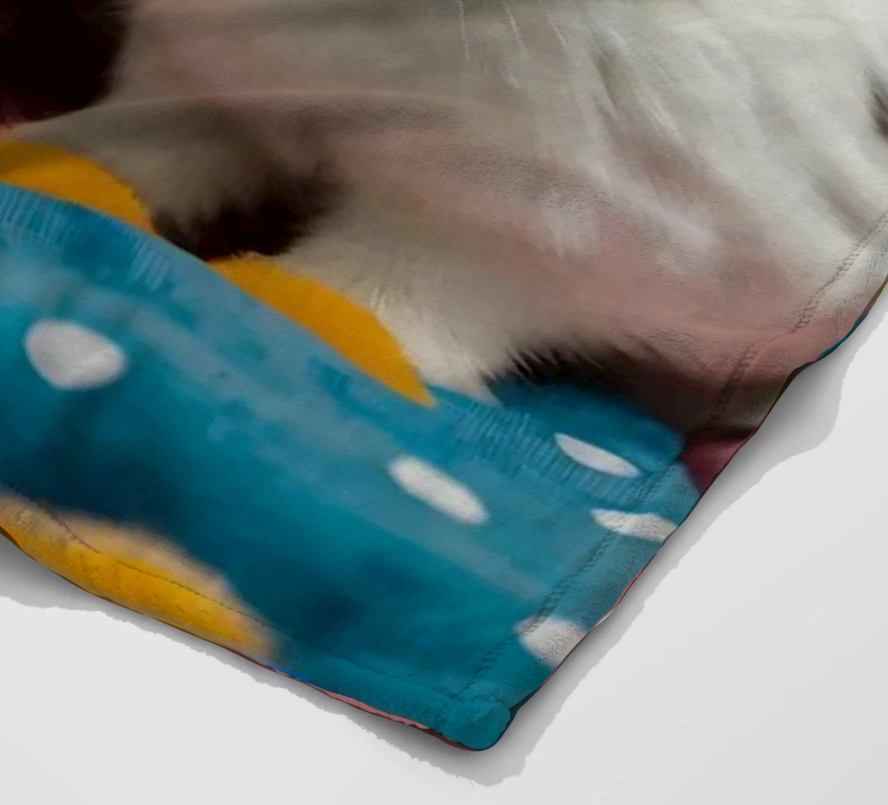 Due adorabili conigli seduti su un'accogliente trapunta colorata coperta in pile da DesignDoodle
