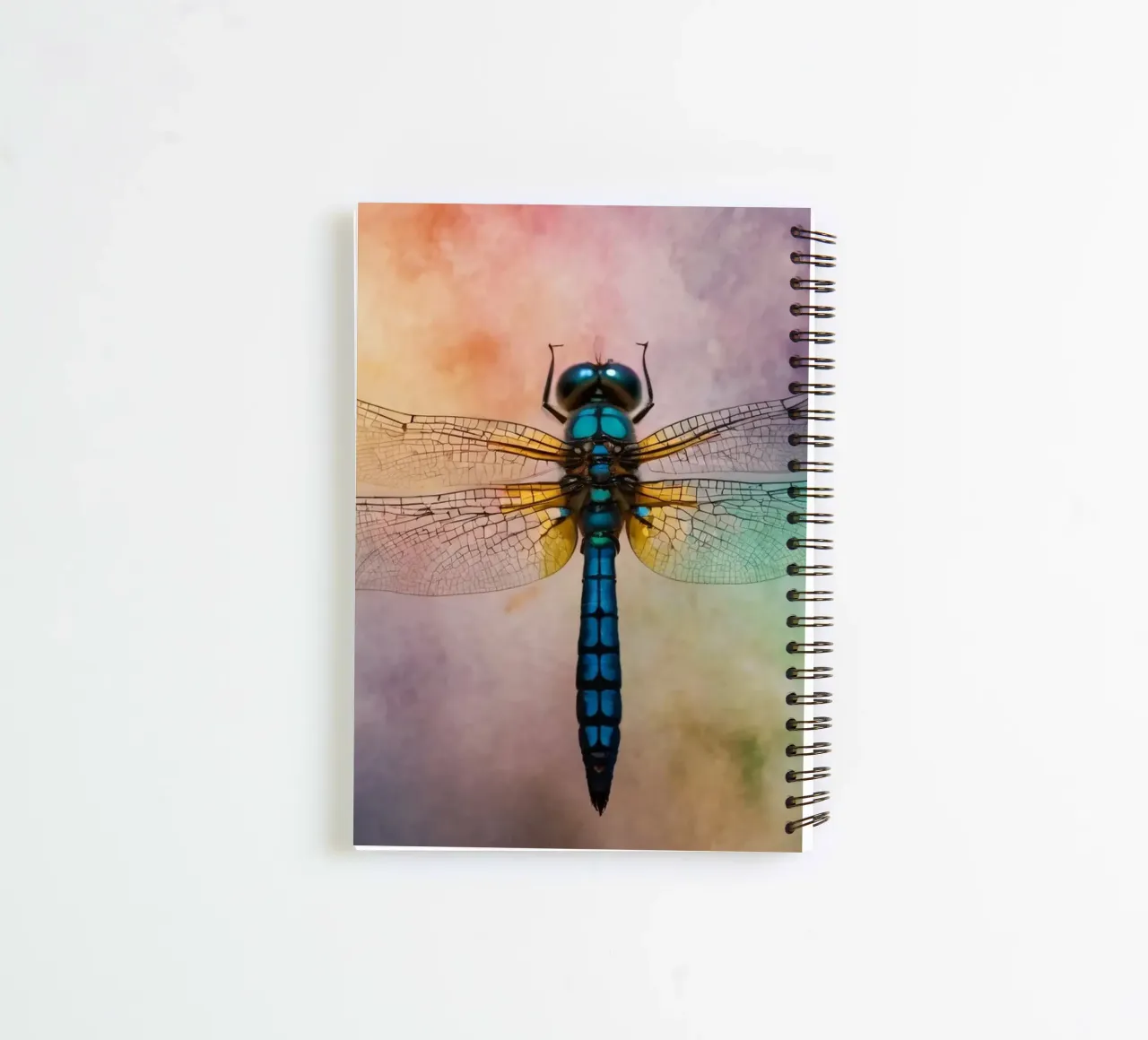 Colorful dragonfly hovering against a vibrant, abstract back spiral notebook by DesignDoodle
