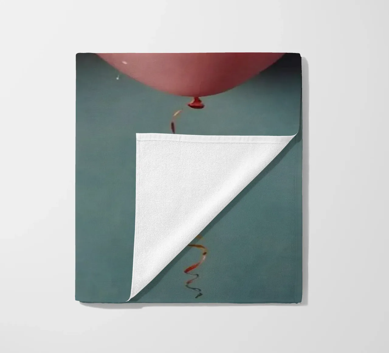 Colorful balloons create a festive atmosphere beach towel by DesignDoodle