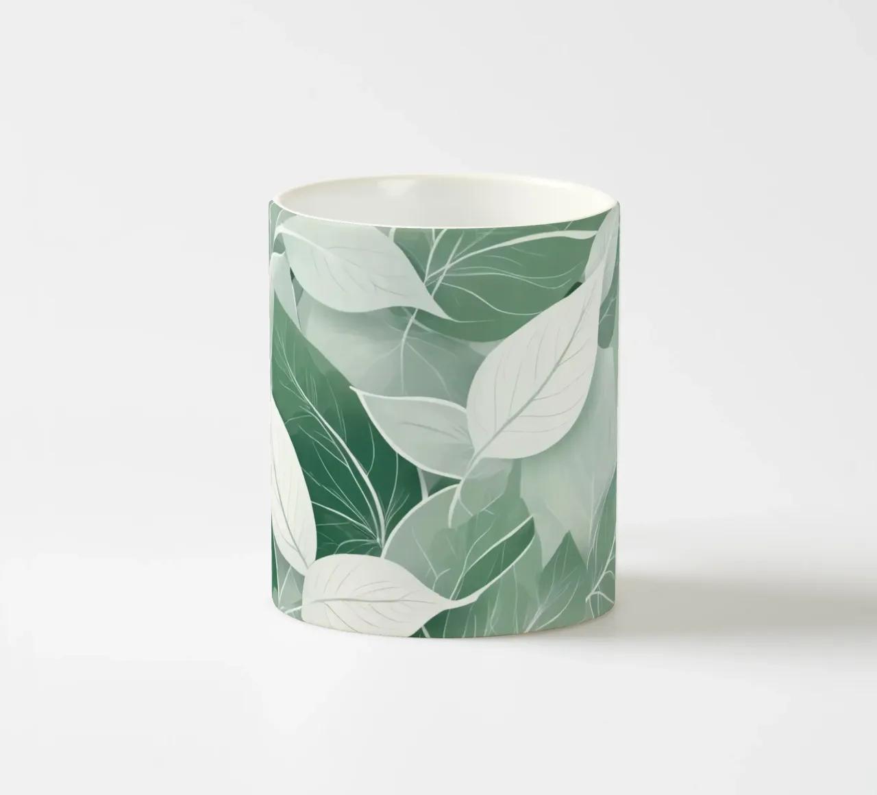 Soft green leaves create a calming botanical pattern ceramic mug by DesignDoodle