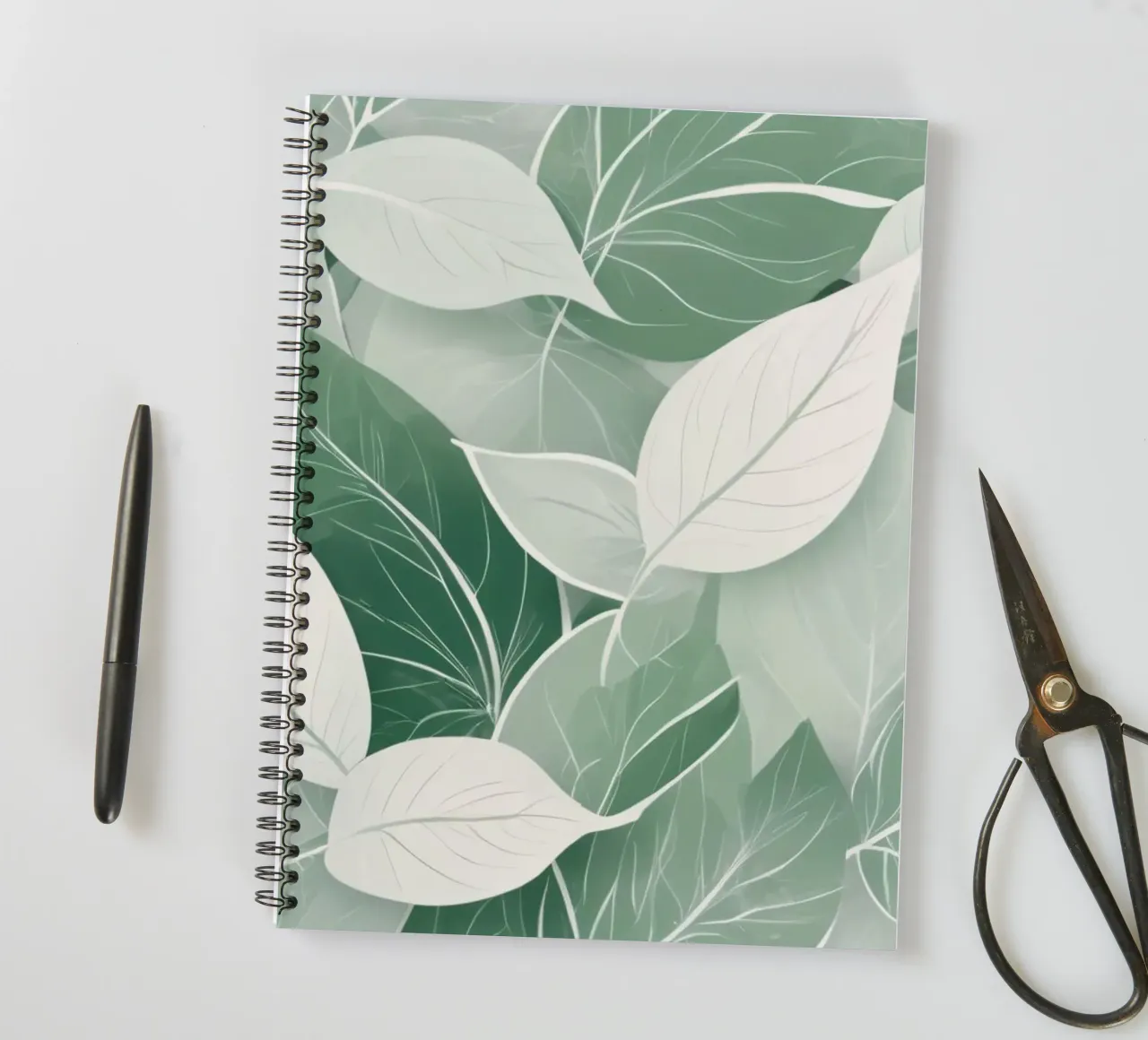 Soft green leaves create a calming botanical pattern spiral notebook by DesignDoodle