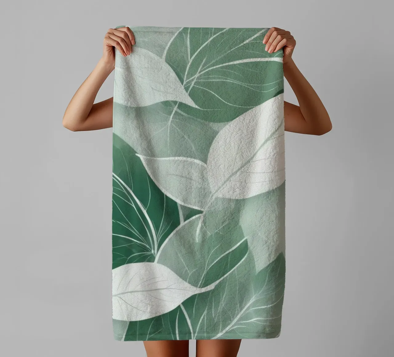Soft green leaves create a calming botanical pattern towel by DesignDoodle