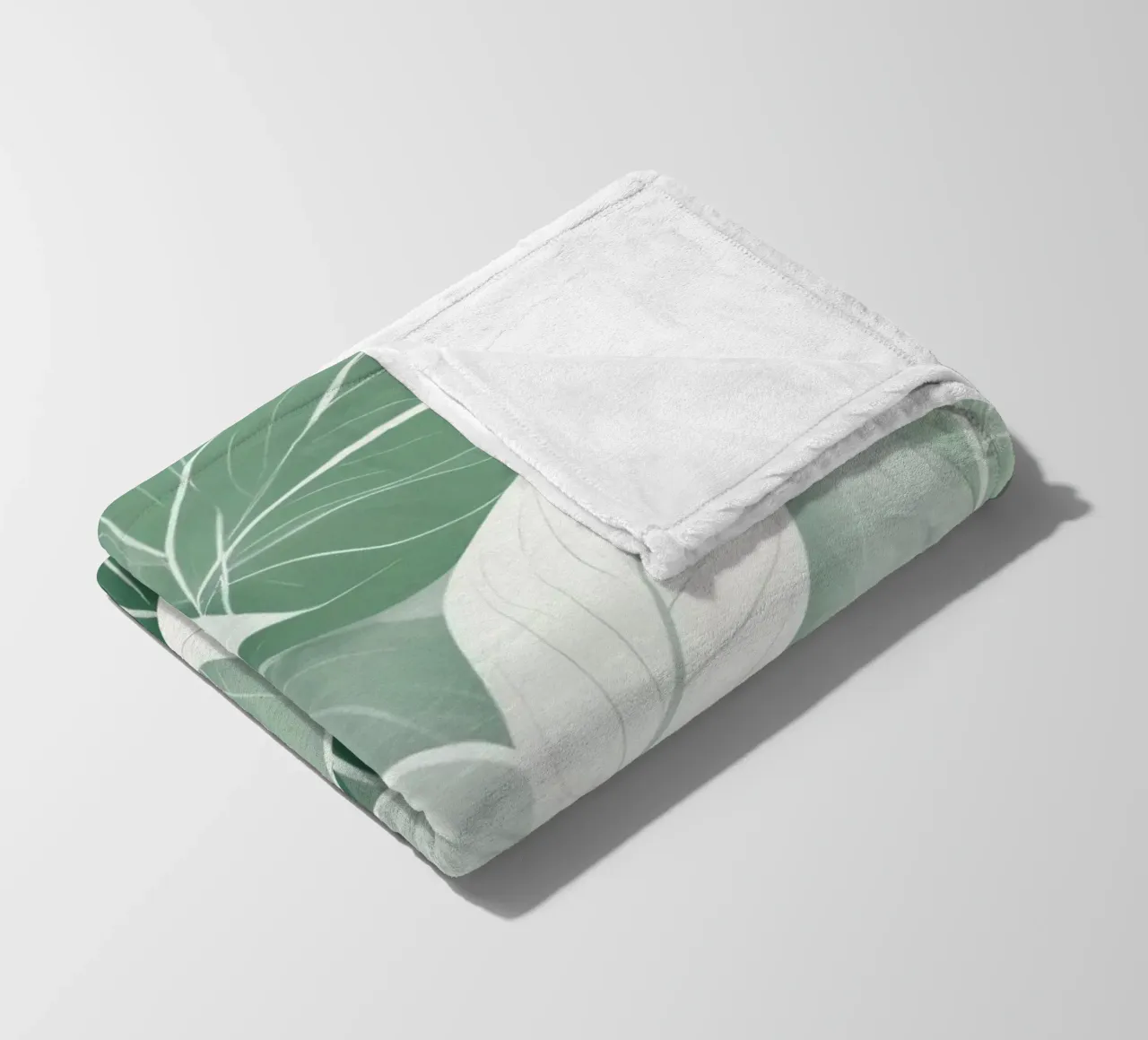 Soft green leaves create a calming botanical pattern fleece blanket by DesignDoodle