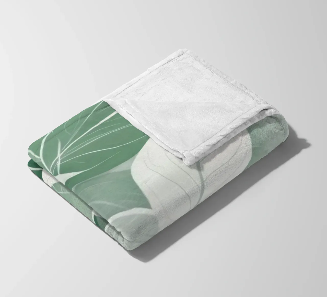 Soft green leaves create a calming botanical pattern fleece blanket by DesignDoodle
